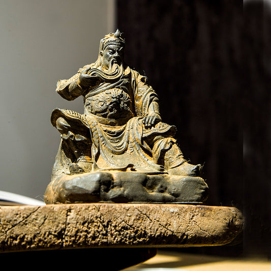 An iron-cast desktop figurine of Guan Yu (Lord Guan), the Martial Sage, in the Chinese style.