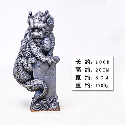 An iron-cast desktop figure in the Chinese style that depicts the water-repelling mythical beast "Gong Fu," signifying harmony and protection from water-related disasters