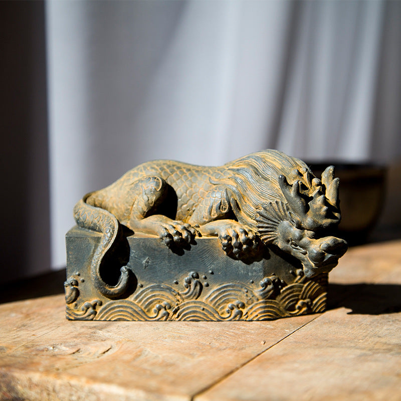 An iron-cast desktop figure in the Chinese style that depicts the water-repelling mythical beast "Gong Fu," signifying harmony and protection from water-related disasters