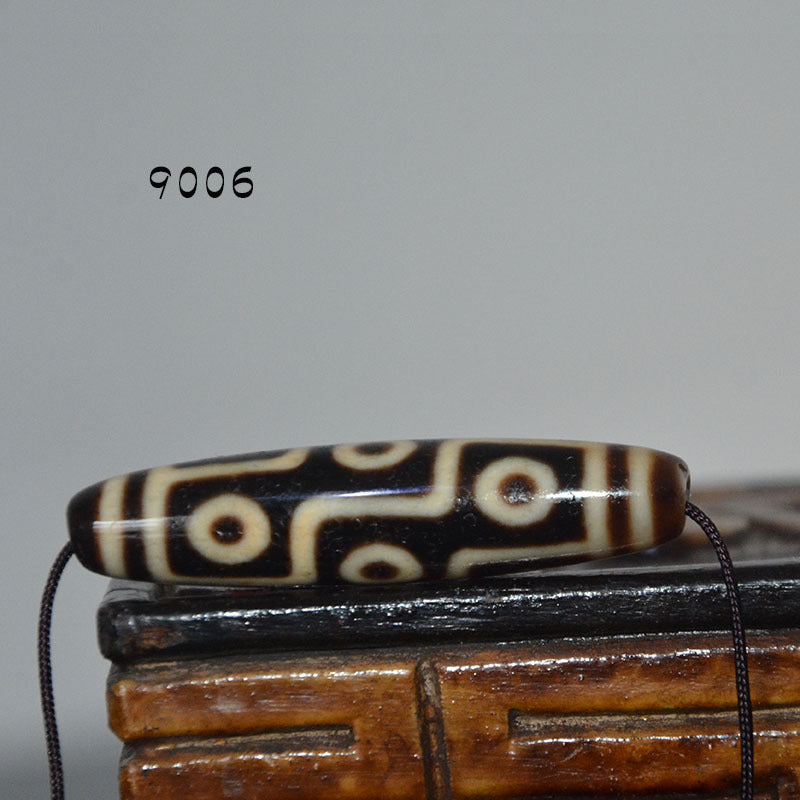 Tibetan Natural Dzi Bead Pendant with Weathered Pattern and High-Gloss Nine-Eyed Design
