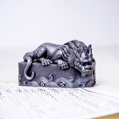 An iron-cast desktop figure in the Chinese style that depicts the water-repelling mythical beast "Gong Fu," signifying harmony and protection from water-related disasters
