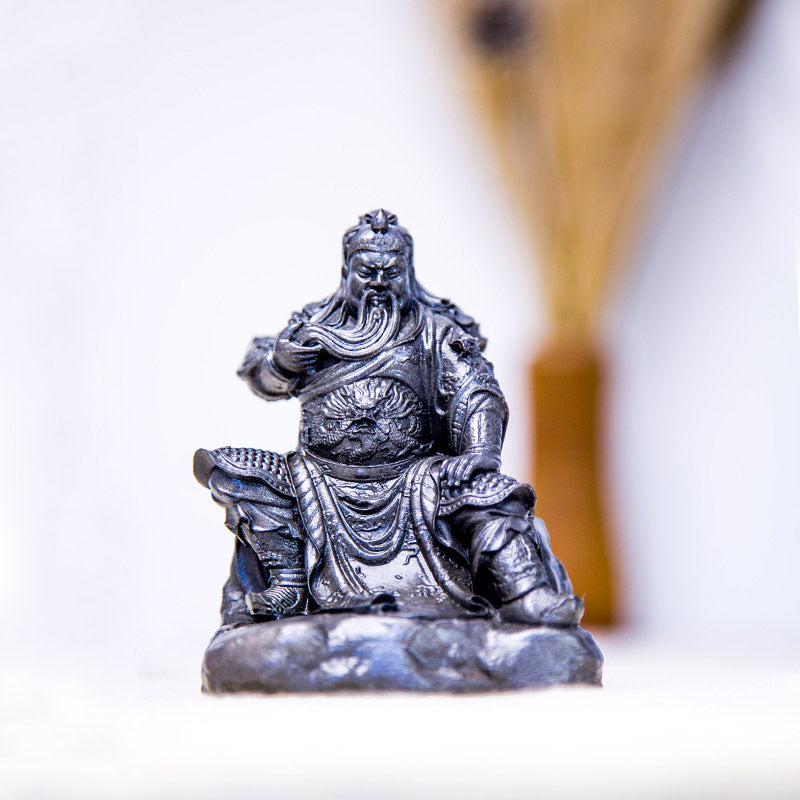 An iron-cast desktop figurine of Guan Yu (Lord Guan), the Martial Sage, in the Chinese style.