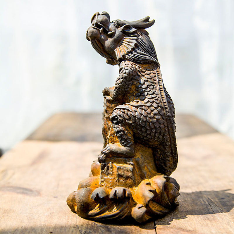 An iron-cast desktop figure in the Chinese style that depicts the water-repelling mythical beast "Gong Fu," signifying harmony and protection from water-related disasters