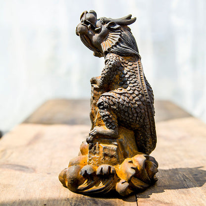 An iron-cast desktop figure in the Chinese style that depicts the water-repelling mythical beast "Gong Fu," signifying harmony and protection from water-related disasters
