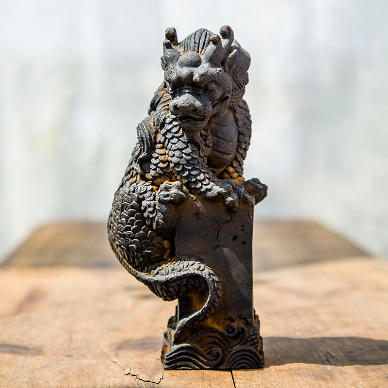 An iron-cast desktop figure in the Chinese style that depicts the water-repelling mythical beast "Gong Fu," signifying harmony and protection from water-related disasters