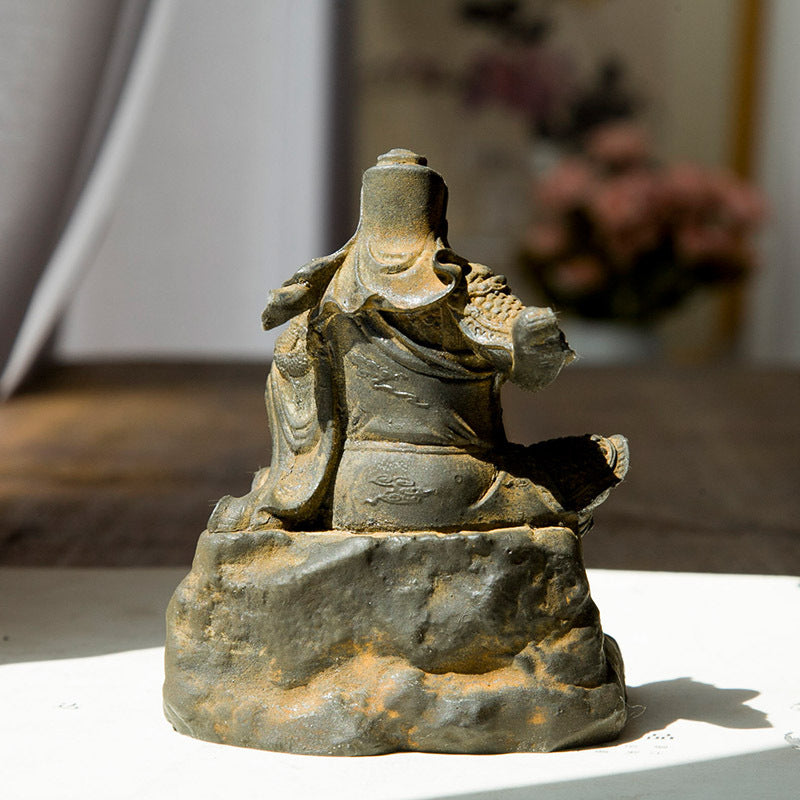An iron-cast desktop figurine of Guan Yu (Lord Guan), the Martial Sage, in the Chinese style.