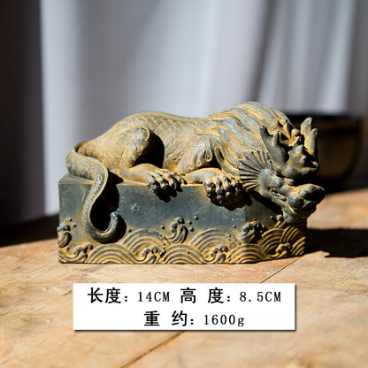 An iron-cast desktop figure in the Chinese style that depicts the water-repelling mythical beast "Gong Fu," signifying harmony and protection from water-related disasters