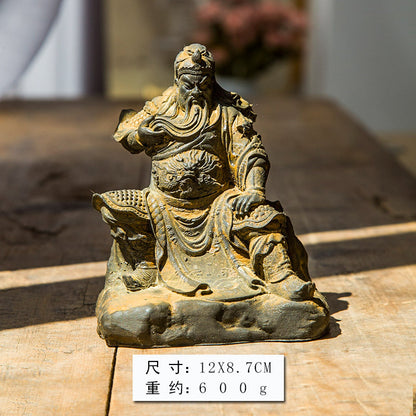 An iron-cast desktop figurine of Guan Yu (Lord Guan), the Martial Sage, in the Chinese style.