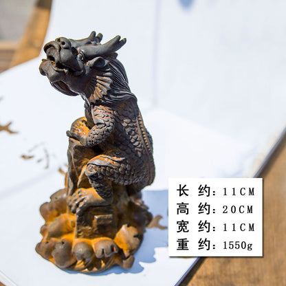 An iron-cast desktop figure in the Chinese style that depicts the water-repelling mythical beast "Gong Fu," signifying harmony and protection from water-related disasters