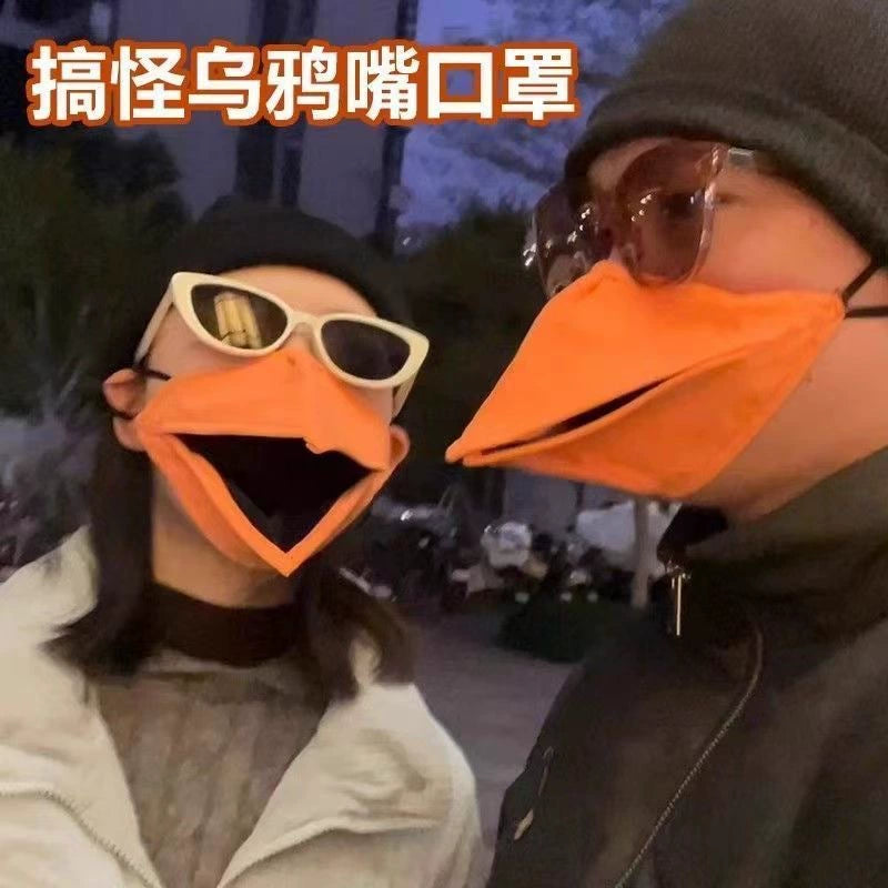 Couple wearing funny crow beak movable masks at night street style