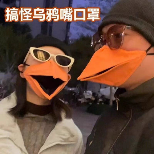 Couple wearing funny crow beak movable masks at night street style