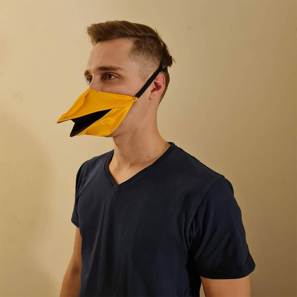 Man wearing yellow duck beak movable mask side view lifestyle shot